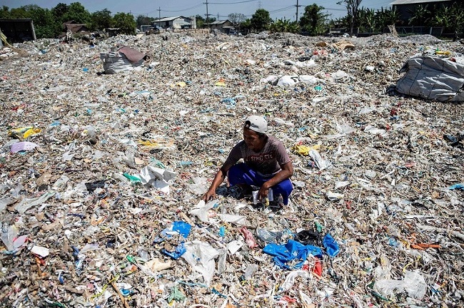 Buried under the weight of a recycling crisis